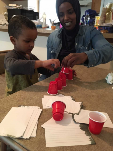 Child playing with cups